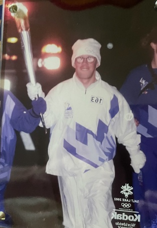 Paul Hovious carrying the Olympic torch through Nashville in December 2001